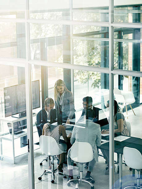 shot of a group of businesspeople in the boardroom